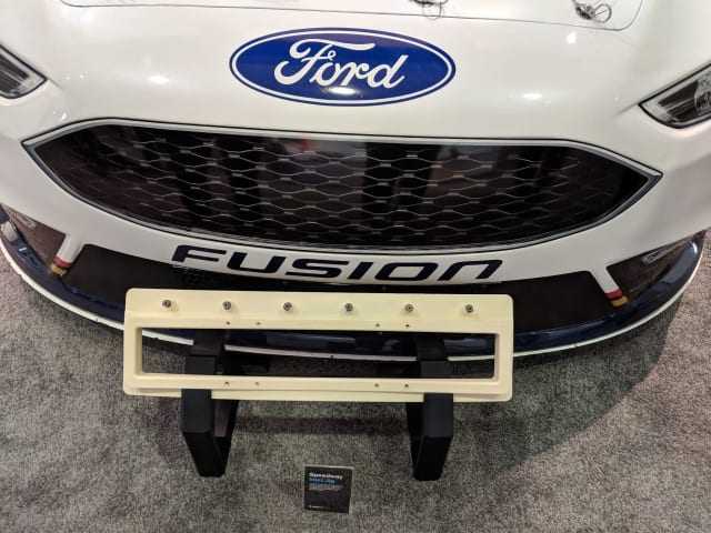 [Stratasys highlighted a jig ready for production on a racing vehicle form Ford // Image source: Author]